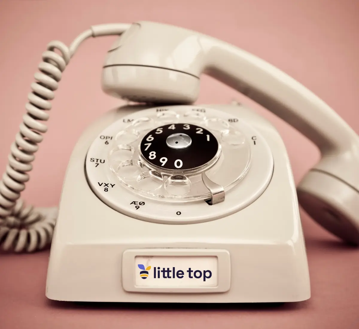Kremowy telefon z logo Little Top